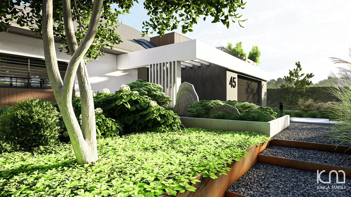 Stopnie zabezpieczone cortenowymi profilami wyłożone granitowym klińcem. Połączenie intensywnej zieleni z kamieniem naturalnym