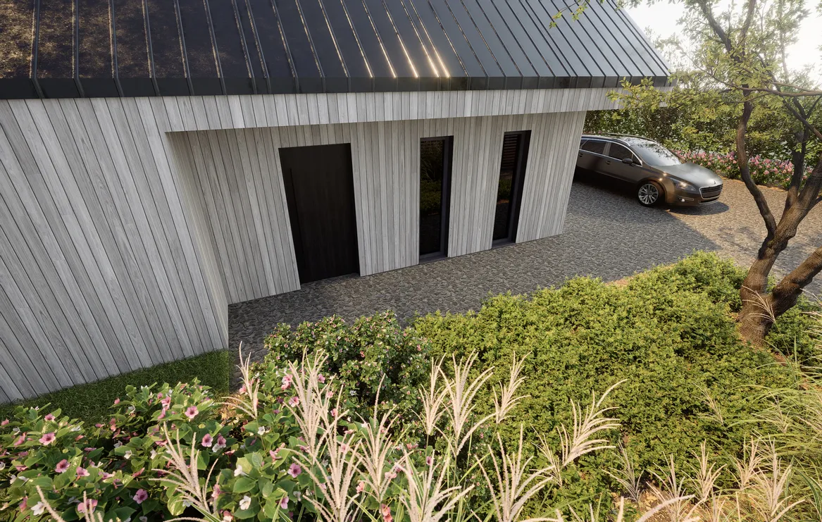 Widok na wejście do domu i układ podjazdu o regularnych kształtach.