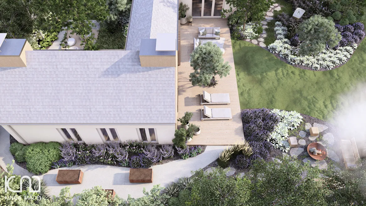 Wzdłuż domu, przy ogrodzeniu znajduje się strefa warzywna z podwyższonymi grządkami.