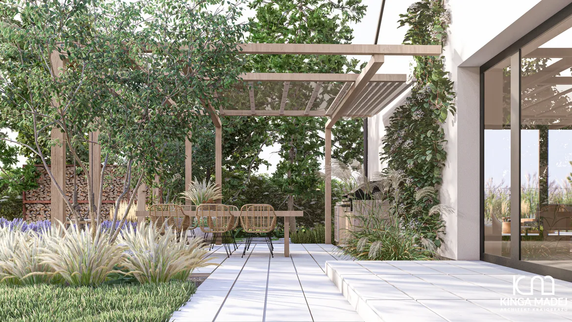 Wyjście z salonu na taras i strefę jadalnianą. W tle cortenowa drewutnia.