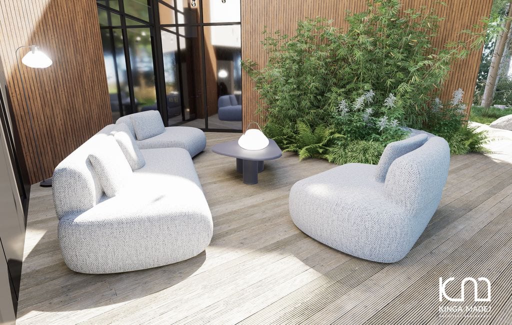 Zbliżenie na taras wypoczynkowy. Z tyłu rabata z bambusami.