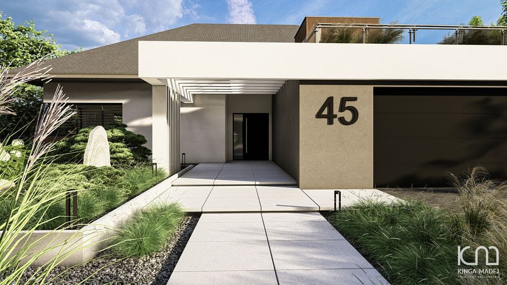 Wejście do domu. Ścieżka z betonowych płyt wielkoformatowych otoczona trawami.