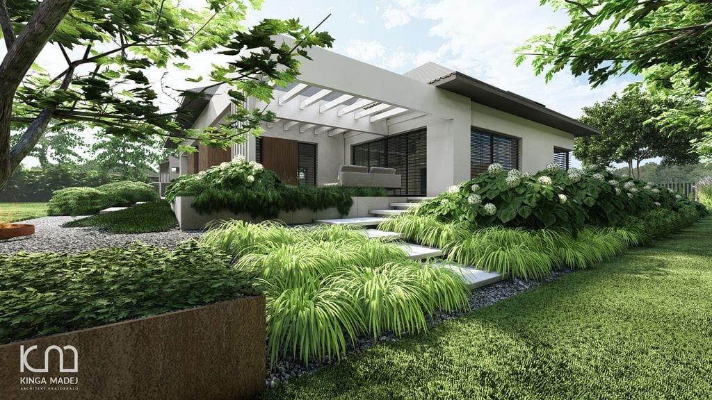 Widok na taras wypoczynkowy z dołu skarpy. Trawy, hortensje, cortenowa misa ogniowa i cortenowy opornik donicy.